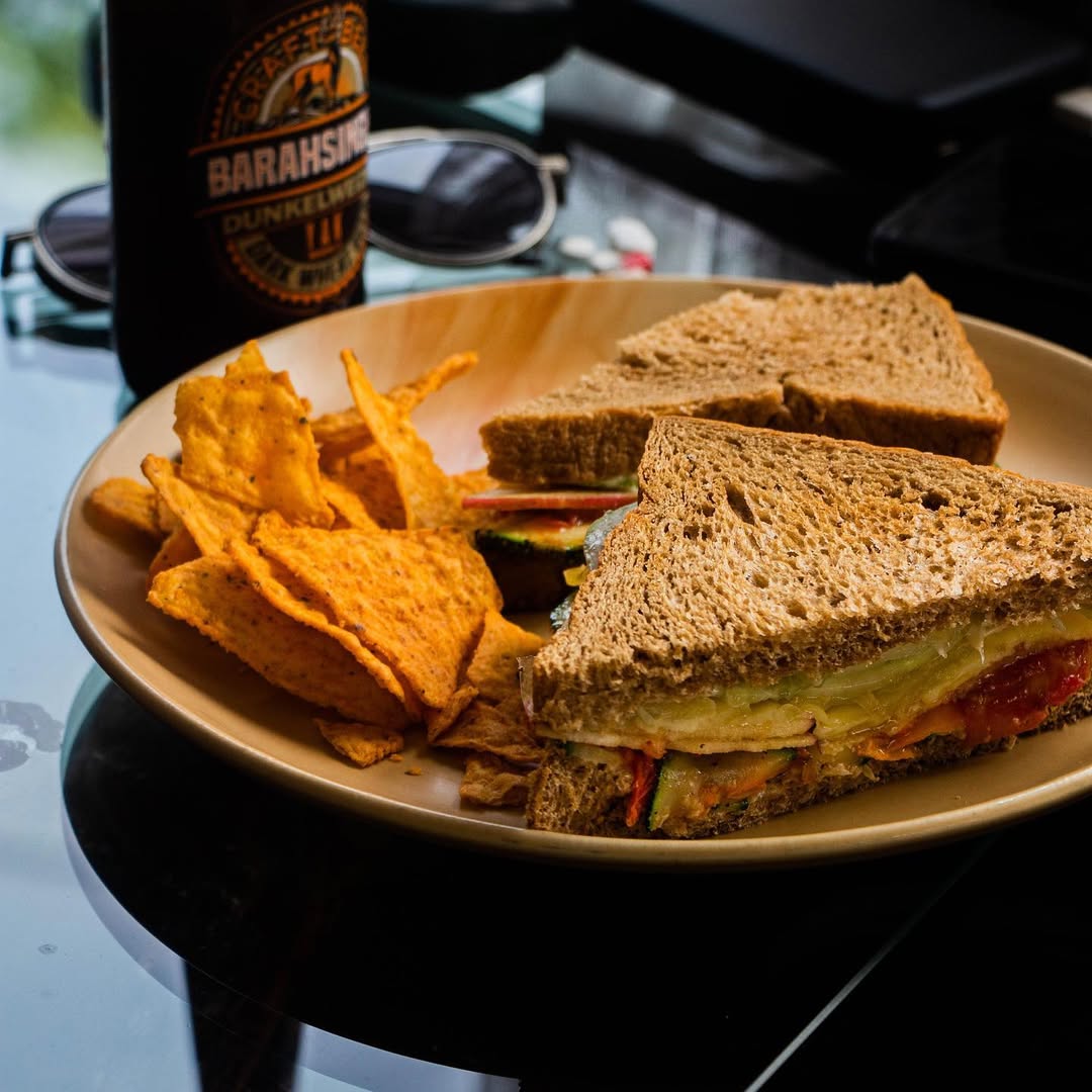 Delicious sandwich with chips at Khim's Café